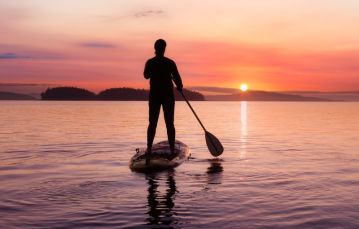 Adult standing on Paddle Board